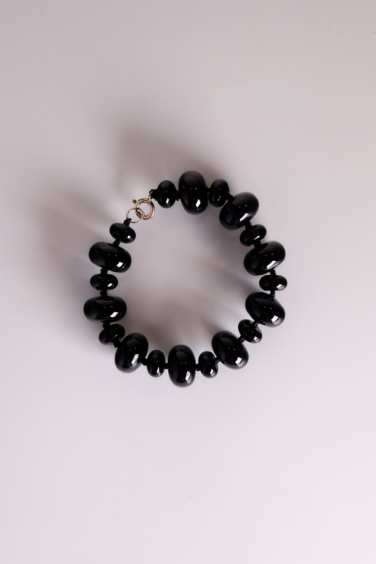Cosmic Void Bracelet, onyx rondelle bracelet on black silk, handmade in Oslo